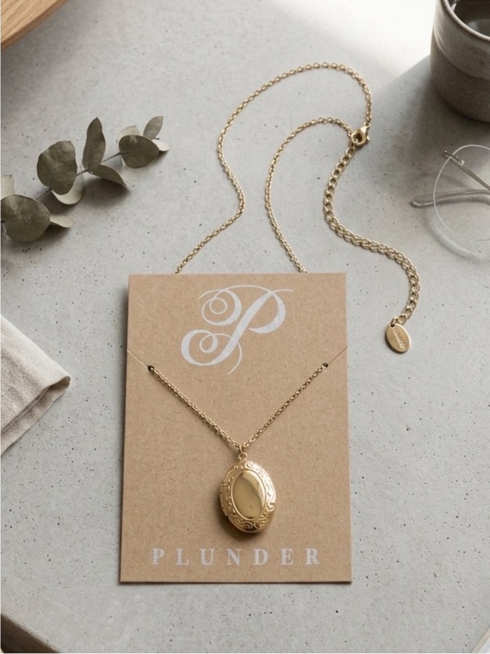 Plunder gold locket necklace with ornate detailing